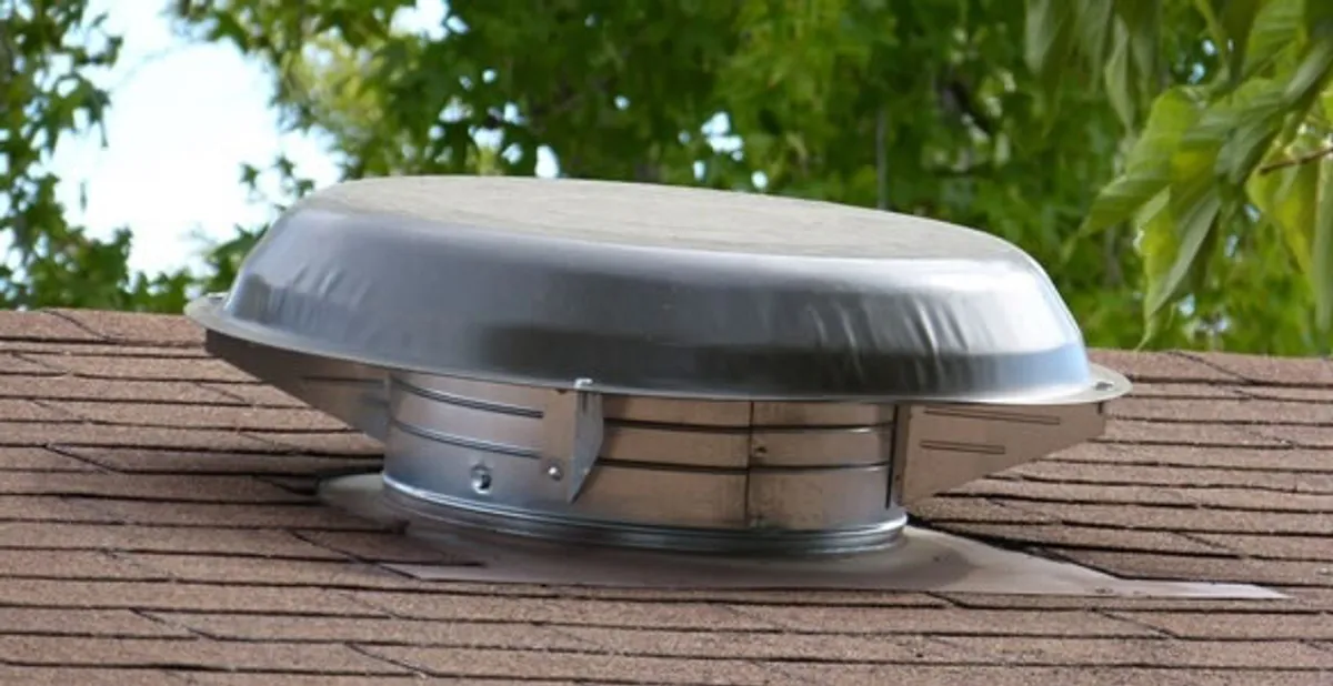 attic fan installation services with low-profile roof ventilation unit in Fresno, CA